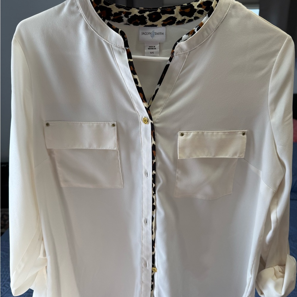 Off-White Button-Up Blouse with Leopard Print Trim and gold details.